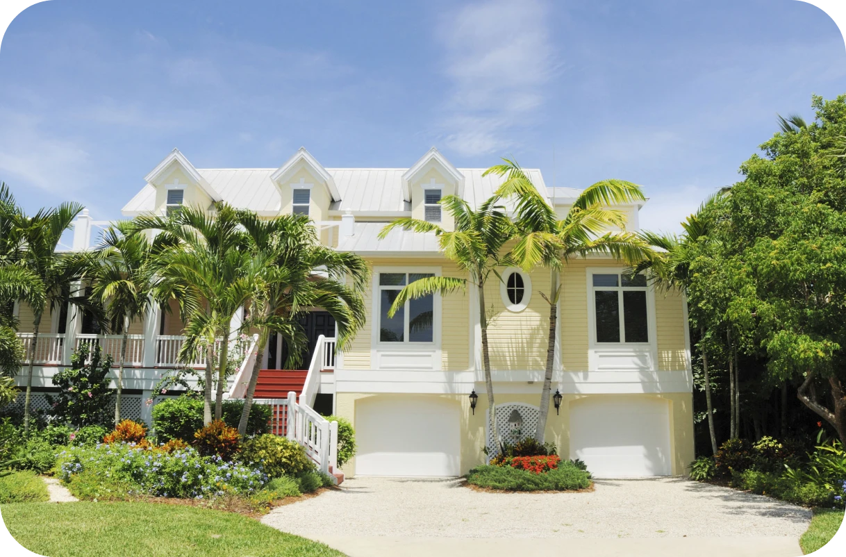 Tropical home with white trim